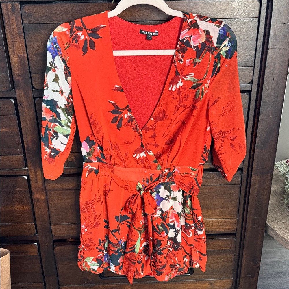 Woman’s orange floral short sleeve romper